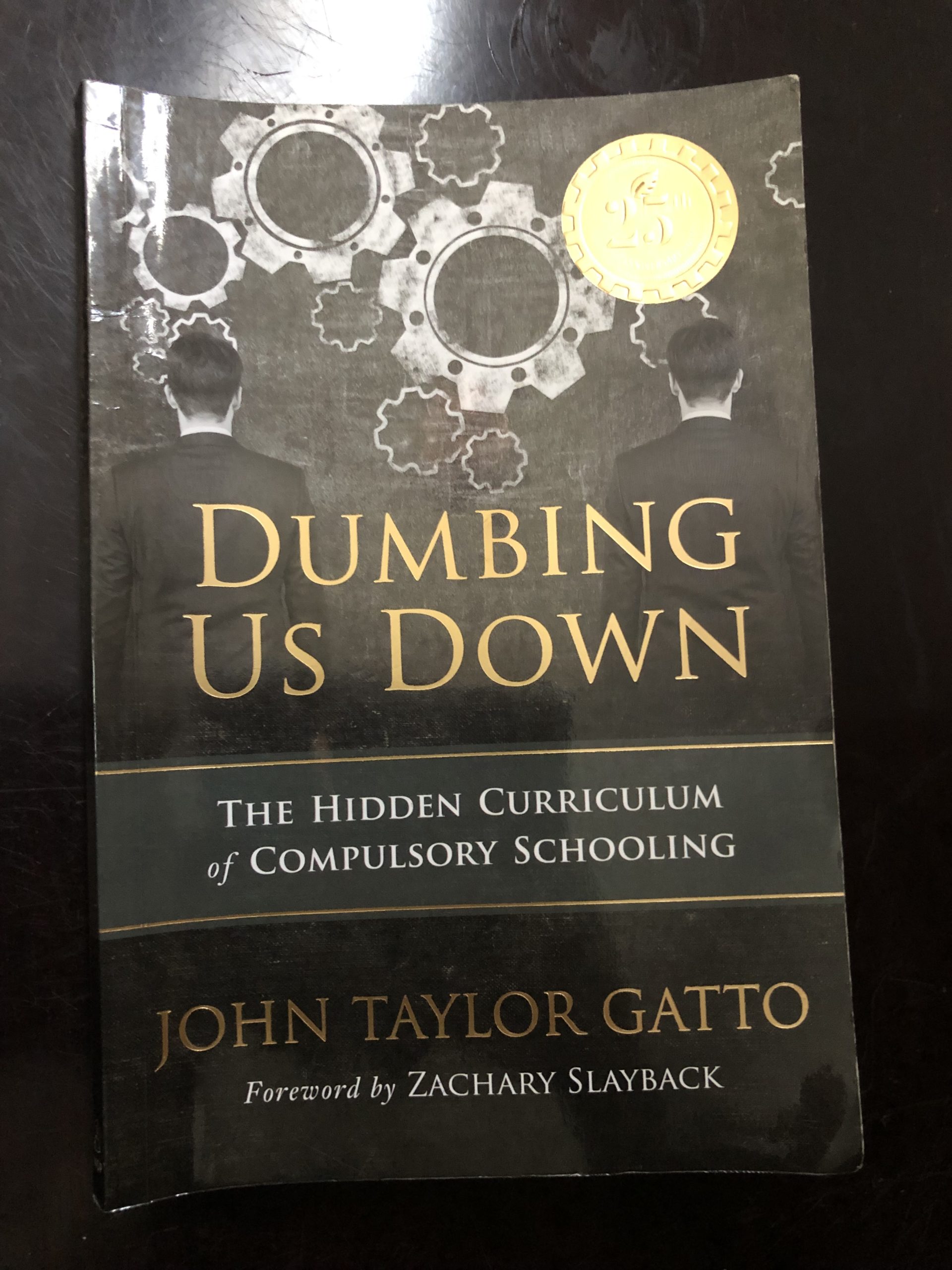 Dumbing us Down Book Cover